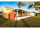 Features a cozy screened porch perfect for enjoying the outdoors, nestled in a well-maintained yard with an inviting backyard at 7113 91St E St, Palmetto, FL 34221