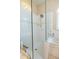 Bathroom featuring a tiled shower with glass door and updated fixtures at 7113 91St E St, Palmetto, FL 34221