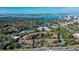 Stunning aerial view of the waterfront condos, lush landscaping, and Sarasota cityscape at 850 S Tamiami Trl # 301, Sarasota, FL 34236