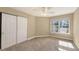 Neutral bedroom featuring carpeted flooring and a sliding-door closet at 850 S Tamiami Trl # 301, Sarasota, FL 34236