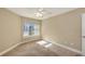 Bright carpeted bedroom bathed in sunlight from a large window at 850 S Tamiami Trl # 301, Sarasota, FL 34236