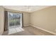 Bedroom featuring carpet, and a sliding door leading to a balcony with outside views at 850 S Tamiami Trl # 301, Sarasota, FL 34236