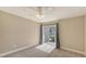 Bedroom with carpet, ceiling fan, natural light, and sliding door leading to outdoor space at 850 S Tamiami Trl # 301, Sarasota, FL 34236
