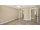 Cozy carpeted bedroom offers a view of an adjoining bathroom at 850 S Tamiami Trl # 301, Sarasota, FL 34236