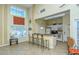 Clubhouse kitchen with white cabinetry and breakfast bar seating, perfect for entertaining at 850 S Tamiami Trl # 301, Sarasota, FL 34236