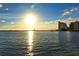 Beautiful waterfront property showcasing upscale apartments with views of the bay during a bright, sunny sunset at 850 S Tamiami Trl # 301, Sarasota, FL 34236