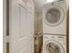 Efficient laundry area with stacked washer and dryer at 850 S Tamiami Trl # 301, Sarasota, FL 34236