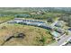 Aerial view of the neighborhood and surrounding landscape, including the community pool at 8612 Milestone Dr, Sarasota, FL 34238