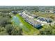 Community aerial showcasing pond views, lush greenery, and well-maintained townhome exteriors at 8612 Milestone Dr, Sarasota, FL 34238