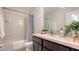 Bathroom featuring a spacious vanity, bright mirror, and a shower with gray curtain at 8612 Milestone Dr, Sarasota, FL 34238