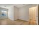 Bright bedroom with neutral walls, wood floors, and a view of exterior, creating a serene atmosphere at 8612 Milestone Dr, Sarasota, FL 34238