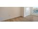 Bedroom with luxury vinyl plank flooring, closet and abundant natural light at 8612 Milestone Dr, Sarasota, FL 34238