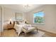 Light and bright bedroom with lots of natural light and a bench at the foot of the bed at 8612 Milestone Dr, Sarasota, FL 34238