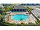 Aerial view of the community pool with ample lounge chairs and covered seating areas at 8612 Milestone Dr, Sarasota, FL 34238