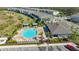 Aerial view of the neighborhood pool and amenity center with palm trees at 8612 Milestone Dr, Sarasota, FL 34238