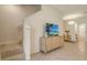 Welcoming entryway with modern console, leading to the dining area and staircase at 8612 Milestone Dr, Sarasota, FL 34238