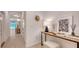 Stylishly decorated entryway with neutral colors and an open view of the adjacent dining area at 8612 Milestone Dr, Sarasota, FL 34238