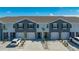 Charming townhomes featuring two-tone paint, well-manicured yards, and attached garages offer modern living at 8612 Milestone Dr, Sarasota, FL 34238