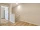 Bright hallway with wood floors and white trim at 8612 Milestone Dr, Sarasota, FL 34238