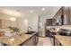 Modern kitchen with granite countertops, stainless steel appliances, and ample cabinet space at 8612 Milestone Dr, Sarasota, FL 34238