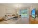 Bright, airy living room features sliding glass doors with serene outdoor views and modern furnishings at 8612 Milestone Dr, Sarasota, FL 34238