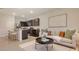 Open-concept living space with a modern kitchen, stylish living room, and ample natural light at 8612 Milestone Dr, Sarasota, FL 34238