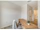 Bright office featuring a modern desk, stylish chair, and minimalist decor at 8612 Milestone Dr, Sarasota, FL 34238