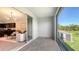 Tiled patio has a view of the grassy yard and pond at 8612 Milestone Dr, Sarasota, FL 34238