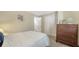 Comfortable bedroom featuring a large closet, warm carpeting, and a calm, relaxing atmosphere at 966 La Costa Cir # 1, Sarasota, FL 34237