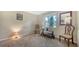 Comfortable bedroom with natural light, carpeted floors, and neutral tones creating a calming retreat at 966 La Costa Cir # 1, Sarasota, FL 34237