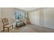 Cozy bedroom with natural light, closet space, and neutral decor for a serene atmosphere at 966 La Costa Cir # 1, Sarasota, FL 34237