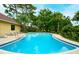 Beautiful community pool with clear water, lounge chairs and a covered pavilion at 966 La Costa Cir # 1, Sarasota, FL 34237
