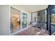 Covered outdoor patio with sliding door access to the interior, seamlessly blending indoor and outdoor living spaces at 966 La Costa Cir # 1, Sarasota, FL 34237