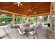 Community pavilion near the pool featuring tables, ceiling fans, and brick paved floor at 966 La Costa Cir # 1, Sarasota, FL 34237