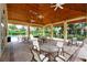 Pool pavilion featuring tables, chairs and overhead fans with pool views at 966 La Costa Cir # 1, Sarasota, FL 34237