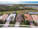 Aerial view of home close to highway with a private backyard pond and easy highway access at 11679 Renaissance Blvd, Venice, FL 34293