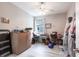 This bedroom features a ceiling fan, a window and is currently being used for storage at 11679 Renaissance Blvd, Venice, FL 34293