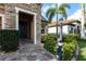 Close up of the entrance to this charming home with stone accents and manicured landscaping at 11679 Renaissance Blvd, Venice, FL 34293