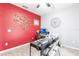 Spacious home office featuring two desk areas, a ceiling fan, and an accent wall at 11679 Renaissance Blvd, Venice, FL 34293