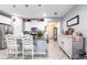 Charming kitchen with white cabinets, stainless steel appliances, and granite countertops at 11679 Renaissance Blvd, Venice, FL 34293