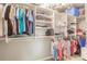 This walk-in closet has custom shelving for organizing clothes, shoes, and accessories at 11679 Renaissance Blvd, Venice, FL 34293