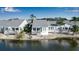 Waterfront home featuring a large, private deck perfect for outdoor entertaining and relaxing with scenic views at 1272 Spoonbill Landings Cir, Bradenton, FL 34209