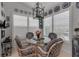 Bright breakfast nook with plantation shutters, glass table, and decorative blue-and-white accents at 1272 Spoonbill Landings Cir, Bradenton, FL 34209