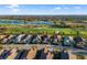 Beautiful community with a golf course and a lake surrounded by well-maintained homes at 15520 Castle Park Ter, Lakewood Ranch, FL 34202