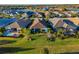 Aerial shot of the property highlighting the backyard, pool, and views of the surrounding area at 15520 Castle Park Ter, Lakewood Ranch, FL 34202