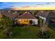 Beautiful backyard with a well-manicured lawn, a view of neighboring houses, and nice landscaping at 15520 Castle Park Ter, Lakewood Ranch, FL 34202