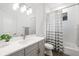 Bright bathroom features a single sink vanity with storage and a shower-tub combination at 15520 Castle Park Ter, Lakewood Ranch, FL 34202