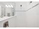 Tiled bathroom featuring a modern sink and shower at 15520 Castle Park Ter, Lakewood Ranch, FL 34202