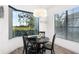 The dining area boasts a modern chandelier and views of the golf course through a bay window at 15520 Castle Park Ter, Lakewood Ranch, FL 34202