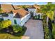 Beautiful home with a three-car garage, tile roof, paved driveway, and lush landscaping at 15520 Castle Park Ter, Lakewood Ranch, FL 34202